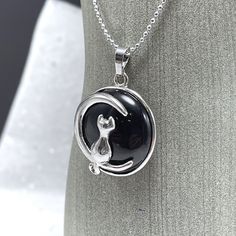 "A delightful image of a kitty cat basking in moonlight is paired with the healing vibration of natural gemstones.  18\" silver metal chain Pendant is about 1\" in diameter Gemstone Meanings: Black onyx:  Gives strength - Promotes vigor, steadfastness and stamina - Brings courage - Imparts self-confidence - Banishes grief - Enhances self-control - Heals old emotional wounds - Stimulates the power of wise decision-making - Encourages happiness and good fortune - Helps to fight basic fears and to Bad Relationships, Moon Cat, Healing Vibrations, Bad Relationship, Gemstone Meanings, Cat Pendants, Cat Necklace, Gemstone Necklace Pendant, Chain Pendant