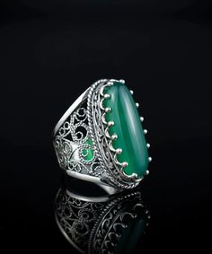 Discover Elegance with Our 925 Sterling Silver Filigree Art Green Agate Gemstone Women's Statement Ring Indulge in the exquisite elegance of our 925 Sterling Silver Filigree Art Green Agate Gemstone Women's Statement Ring. Meticulously crafted with intricate filigree details, this ring adds a touch of luxury to any outfit. With a natural Green Agate gemstone in a cabochon oval-cut, this statement ring is a true masterpiece. Masterful Craftsmanship and Unique Design At a length of 1.00" and a wid Long Ring, Silver Cocktail, Art Ring, Knuckle Ring, Art Green, Sterling Silver Filigree, Green Agate, Filigree Ring, Silver Filigree