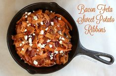 bacon, feta and sweet potato ribbons in a cast iron skillet on a white cloth