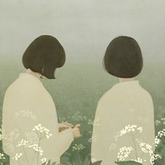 two people standing in the middle of a field with white flowers on their backs, facing each other