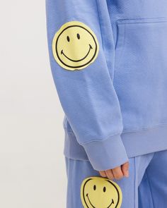 OFFICIAL COLLABORATION WITH SMILEY® This Smiley Oversized Hoodie pairs amazingly with our Smiley Open Leg Sweatpants. They are perfect for a coffee run, casual errand, or even your daily trip to the market any day of the week, any season of the year. These are made to make you FEEL happy. They are made from super comfy heavyweight French terry fabric that has raw-edge smiley patches on the elbows. Designed with comfort in mind, this is going to keep you smiling every day!  👉 Free USA Shipping On All Orders  👉 Happiness Guaranteed  👉 Easy Exchanges & Returns Details: 12 oz French terry Oversized fit Raw edge smiley patches Panel inserts on sleeves Kangaroo pocket on the front The model is 5'7" wearing a size small Open Leg Sweatpants, Patch Panel, Coffee Run, Mr Men, Sweat Set, Feel Happy, Satin Jackets, Terry Fabric, Seasons Of The Year