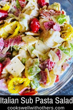 this italian sub pasta salad is loaded with lots of fresh ingredients, including tomatoes, lettuce and cheese