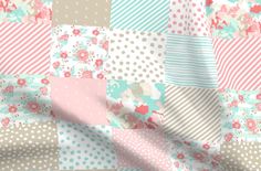 a patchwork quilt with flowers and polka dots on pink, blue, green, white