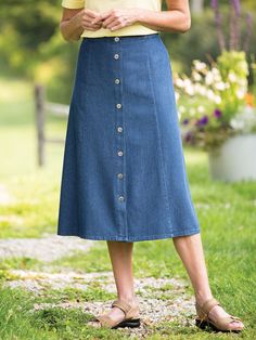 Some customers love our eight-gore denim skirt for its basic good looks. Others love it for its versatile nature — and pair it with a blouse, sweater, or vest to create instant outfits. But it's the skirt's easygoing fit that makes it a real standout. The roomy A-line style is finished with a flat waistband in front, elastic in the back and a full button front that allows you to bend and move about freely — so you feel as good as you look! Relaxed fit skirt with eight gores Classic A-line style Black Midi Skirt Outfit, Denim Skirt Fashion, Denim Shorts Outfit, Gored Skirt, Vermont Country Store, Midi Skirt Outfit, Denim Skirt Outfits, Long Denim Skirt, Skirt With Buttons