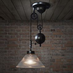 an old fashioned light hanging from the ceiling