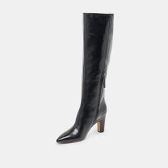 Every wardrobe needs a dressier knee-high boot. NELAS fits the bill with an understated design in sophisticated leather. Style her with short dresses or under wide leg jeans. Leather Upper Rubber Outsole Synthetic Lining + Sock 15.4" Shaft Height 14.5" Leg Circumference 3.2" Heel Height Imported Tall Heeled Boots For Formal Fall Occasions, Tall Heeled Boots For Fall Formal Events, Formal Knee-high Boots For Fall, Formal Fall Knee-high Boots, Chic Knee-length Evening Boots, Chic Leather Mid-calf Boots, Chic Tall Leather Mid-calf Boots, Tall Knee-high Boots For Formal Fall Occasions, Tall Formal Knee-high Boots For Fall