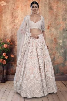 Elevate your bridal look with our exquisite Bridal Lehenga BL-293. This peach outfit features delicate white threadwork and a graceful train, making it the perfect choice for an outdoor wedding. Make a statement on your special day with this luxurious and sophisticated ensemble. Peach Outfit, Peach Clothes, Blush Bridal, Bridal Looks, Western Fashion