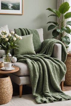 a living room with a couch, coffee table and potted plants