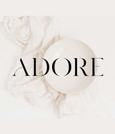 the word adore on top of a white bowl