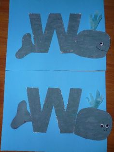 two pieces of paper with the letters w and w cut out to look like fish