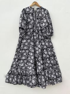 DESCRIPTION black floral printed summer style long maxi dress / Henley neckline with button maxi dress / 3/4th sleeve with button long maxi dress Indian (Jaipur) Traditional Hand Block Printed Dresses for summer vacations, beaches wear, party wear, and more occasions to wear this dresses. PRODUCT DETAILS: 3/4th sleeve, Henley neck, Long dress FABRIC: soft and breathable cotton cambric WASH CARE:  wash in cold water, air dry in shade.. SLEEVE LENGTH - 18 inch Size chart is mentioned in images. Size chart is given of the garment not the person wearing the garment We will be happy to customize according to your measurements. Message us for custom wholesale orders. Color of given picture may slightly vary due to sunlight, screen's resolution and camera focus. also you can write for more inform Printed Maxi Dress With 3/4 Sleeve For Vacation, Black Floral Print Floor-length Maxi Dress, Printed 3/4 Sleeve Maxi Dress For Beach, Printed 3/4 Sleeve Maxi Dress For Vacation, Black Printed Maxi Dress, Chic 3/4 Sleeve Maxi Dress For Beach, Chic Beach Maxi Dress With 3/4 Sleeves, Chic Maxi Dress With 3/4 Sleeves For The Beach, Black Midi Dress With Floral Print And 3/4 Sleeve