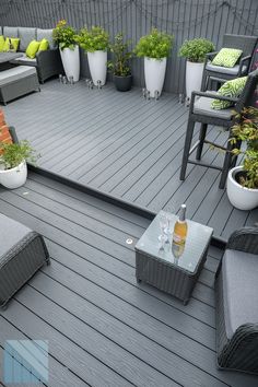 Modern garden design with anthracite grey decking Veranda Decking Ideas, Styling Decking Area, Decked Seating Area, Decking Designs Layout, Decking Paint Ideas, Composite Decking Ideas Garden