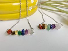 We love the simplicity of these chip necklaces. The beads included are: red jasper, tiger's eye, citrine, green aventurine, sodalite, amethyst, rose quartz, and clear quartz. Shipping is included with these necklaces. Multicolor Stone Crystal Necklace Gift, Handmade Multicolor Crystal Necklace, Rainbow Crystal Necklaces With Natural Stones, Chakra Necklace Crystals, Seven Chakras Necklace, Chip Bead Necklace, Colorful Necklace, Chakra Pendant, Necklace Colorful