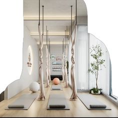 a yoga studio with white walls and wood flooring is featured in this modern interior design