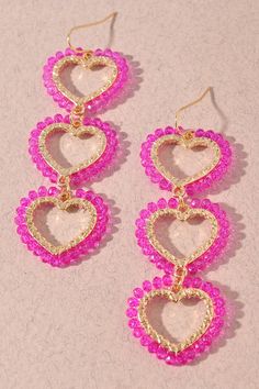 "Playfully show off your love with our Triple Heart Drop Earrings, available in vibrant Fuchsia or sweet Pink. Featuring three beaded hearts, these earrings will add a fun touch to any outfit. Perfect for those who don't take themselves too seriously!" Heart Bead Drop Earrings For Party, Heart-shaped Beaded Earrings For Party, Heart-shaped Beaded Party Earrings, Pink Dangle Beaded Earrings For Valentine's Day, Dangle Beaded Earrings With Heart Beads For Party, Pink Heart Beads Earrings For Party, Pink Beaded Heart Earrings For Party, Pink Heart-shaped Beaded Earrings For Parties, Pink Beaded Heart Earrings For Valentine's Day