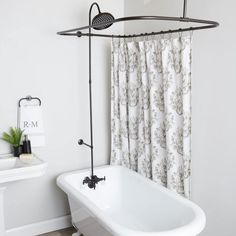 a white bath tub sitting next to a window