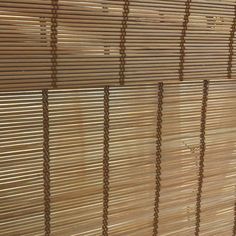 a close up view of bamboo blinds on a wall