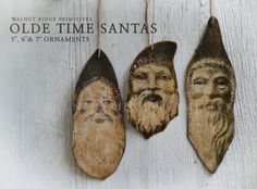 three old time santa's hanging from strings on a white wooden background with text that reads walnut ridge primitives