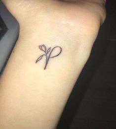 a person with a small tattoo on their wrist