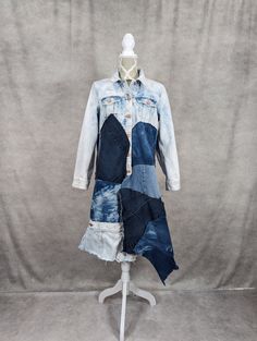 a dress made out of jeans on a mannequin headdress with blue and white patches