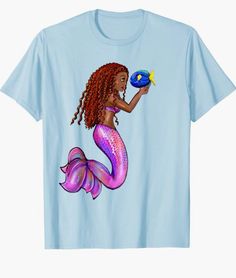 a t - shirt with an image of a mermaid holding a fish