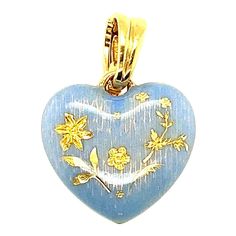 This modern 18 karat yellow gold Faberge heart pendant was made by Victor Mayer. The perriwinkle blue enamel heart was crafted in the same tradition of the original Imperial eggs using Faberges iconic guilloche enameling techniques. The heart measures 1" including the hinged 18 karat yellow gold bale. Stamped Faberge Germany 18K #288/500 Original Faberge Certificate of Authenticity included Blue Enamel Pendant Jewelry, Luxury Blue Heart Pendant Jewelry, Yellow Gold Enamel Heart Charm Jewelry, Yellow Enamel Pendant Jewelry, Faberge Egg Necklace, Clear Winter, Faberge Jewelry, Diamond Face, Winter Color Palette