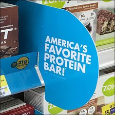 a blue sign that says america's favorite protein bar on display in a store