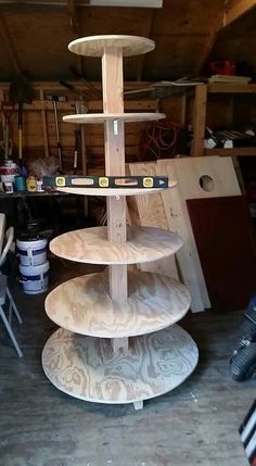 three tiered wooden display stand in a garage