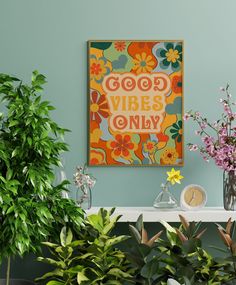 there is a painting that says good vibes only on the wall next to potted plants