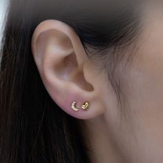 Such a cute, and dainty pair of earrings! They're perfect alone or stacked. They're a tiny pair that are perfect for second piercings, cartilage piercings, or for a minimalist touch. ✤✤ Details ✤✤ ★ Made of 925 Sterling Silver ☾ We use a THICK plating of 14k Gold or Rhodium for a piece that is sure to last you years to come ★ Sold as a PAIR ☾ Nickel-free & Hypoallergenic ★ Measures 5 mm x 4 mm ☾ We use the highest grade of cubic zirconia for an authentic diamond look Comes in a cute gift box Dainty Moon Shaped Hypoallergenic Earrings, Dainty Hypoallergenic Moon-shaped Earrings, Dainty Moon-shaped Hypoallergenic Earrings, Dainty Round Heart Earrings For Pierced Ears, Dainty Hypoallergenic Moon Earrings, Dainty Half Moon Charm Earrings, Dainty Half Moon Earrings With Moon Charm, Dainty Round Heart Earrings, Dainty Crescent Cartilage Earrings As Gift