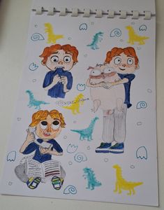 children's drawing of two boys and a dog on a sheet of paper with colored crayons