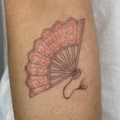 a tattoo on the leg of a man with an umbrella in it's hand