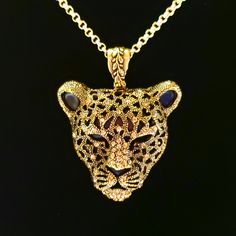 Awesome Black Panther Head Pendant with sparkling Gold Rhinestones and a Gold Finish to highlight his features. Pendant Head measures 2" Length, 1 7/8" Wide. Pendant Drop is 2 1/2". Stunning Antique Gold Brass Oxide Plated Pewter Bail (hanger) in Vine motif. 20" 14K Gold Plated Rolo Chain with designer Antique 14K Gold Plated Floral EZ Toggle Clasp. In the Men's section see the same Pendant with a Lobster Clasp and different Chain. Gorgeous!!! Luxury Gold Jeweled Necklace, Luxury Yellow Gold Jewelry With Rhinestones, Gold Diamond Jeweled Necklace, Gold Filigree Cubic Zirconia Jewelry, Gold Filigree Jewelry With Cubic Zirconia, Gold Diamond Necklace With Jeweled Detail, Panther Head, Sand Dollar Pendant, Leopard Head