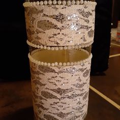 there are three candles that have been decorated with sequins and pearls on them