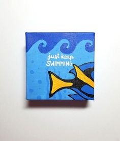 a painting of a yellow fish with the words just keep swimming on it