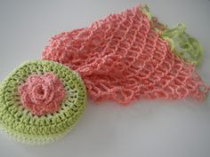 two crocheted items are laying next to each other