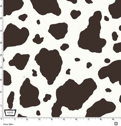 a black and white cow print with spots on it's skin is seen in this image