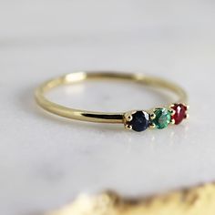 Dainty Three Stone Ring 14k Solid Gold, Sapphire, Ruby, Emerald Ring, Minimalist Ring, Colorful Gemstone Ring Material; ***14k solid gold band and prongs ***Stones are 2.5mm each, real sapphire, emerald and ruby. ***Prong settings. ***1.2mm band ***Can be personalize with any birthstone you choose. Please contact me. Thanks for visiting Melt'm Design Studio 14k Gold Three-stone Emerald Ring As Gift, Elegant Three-stone Birthstone Ring In 14k Gold, 14k Gold Cluster Ring With Birthstone For Promise, 14k Gold Multi-stone Stackable Rings, 14k Gold Three Stone Ruby Ring For Anniversary, 14k Gold Three Stone Ruby Promise Ring, 14k Gold Three Stone Diamond Ring For May Birthstone, 14k Gold Multi-stone Stackable Rings For Anniversary, 14k Gold Three Stone Round Band Jewelry