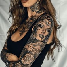 a woman with tattoos on her arm and shoulder