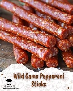 some very tasty looking sausage sticks on a wooden board with the words wild game pepperoni sticks