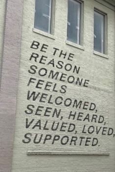 a sign on the side of a building that says be the reason someone feels welcome