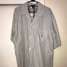 This Is A "Polo Ralph Lauren" Short Sleeve Shirt, New Without Tags. It Is Gray And White Pinstripe, With A Red Polo Pony On The Front Pocket. 100% Cotton, Made In El Salvador. Size Large Men's. Striped Cotton Shirt For Loungewear, Casual Striped Shirt For Loungewear, White Camp Collar Shirt For Loungewear, Casual White Shirt For Daywear, White Collared Lounge Top, Casual White Daywear Shirt, White Collared Top For Loungewear, White Cotton Shirt For Loungewear, White Cotton Loungewear Shirt