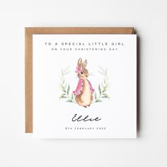 a card with an illustration of a bunny wearing a pink scarf