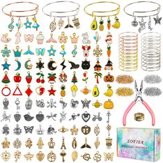 a bunch of different types of earrings on display next to a box with scissors and other items