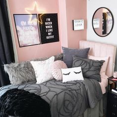 a bed room with a neatly made bed and pillows