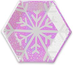 a pink and white snowflake paper plate on a white background with silver stars