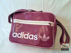 An original vintage Adidas sport bag from the 1980's. An absolute gem for vintage fans. Size:  40 x 30 x15 H x W x D (all dimensions are in cm) Materials: artificial leather, textile, metal condition: The bag is in excellent vintage condition, depending on its age.  The zippers work perfectly. Signs of use. See pictures for details. Shipping: - My shop ships worldwide. - If you like, select the "EXPRESS  shipping" option in the order process to get faster shipping. - You can see the shipping pri Adidas 2000 Vintage, Adidas Bag, Get Faster, Adidas Bags, Adidas Vintage, Vintage Sport, Sports Bags Gym, Vintage Fans, Vintage School