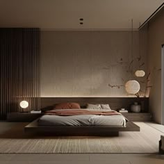 a large bed sitting in the middle of a bedroom next to a wall mounted lamp