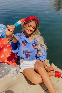 - You were born to sparkle with this sweet crop top! - Unlined material patterned with a sequined silver, red, and blue hued American themed cupcakes - A crew cut neckline with a v-notch accent - Short, loose drop sleeves - An oversized silhouette that ends in an unfinished, rolled, cropped hemline American Flag Print Long Sleeve Top For Summer, American Flag Print Long Sleeve Summer Top, Fun Blue Tops For 4th Of July, Born To Sparkle, Crew Cut, Themed Cupcakes, Crew Cuts, Oversized Silhouette, Crop Tee