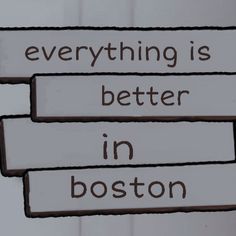 there are three signs that say everything is better in boston